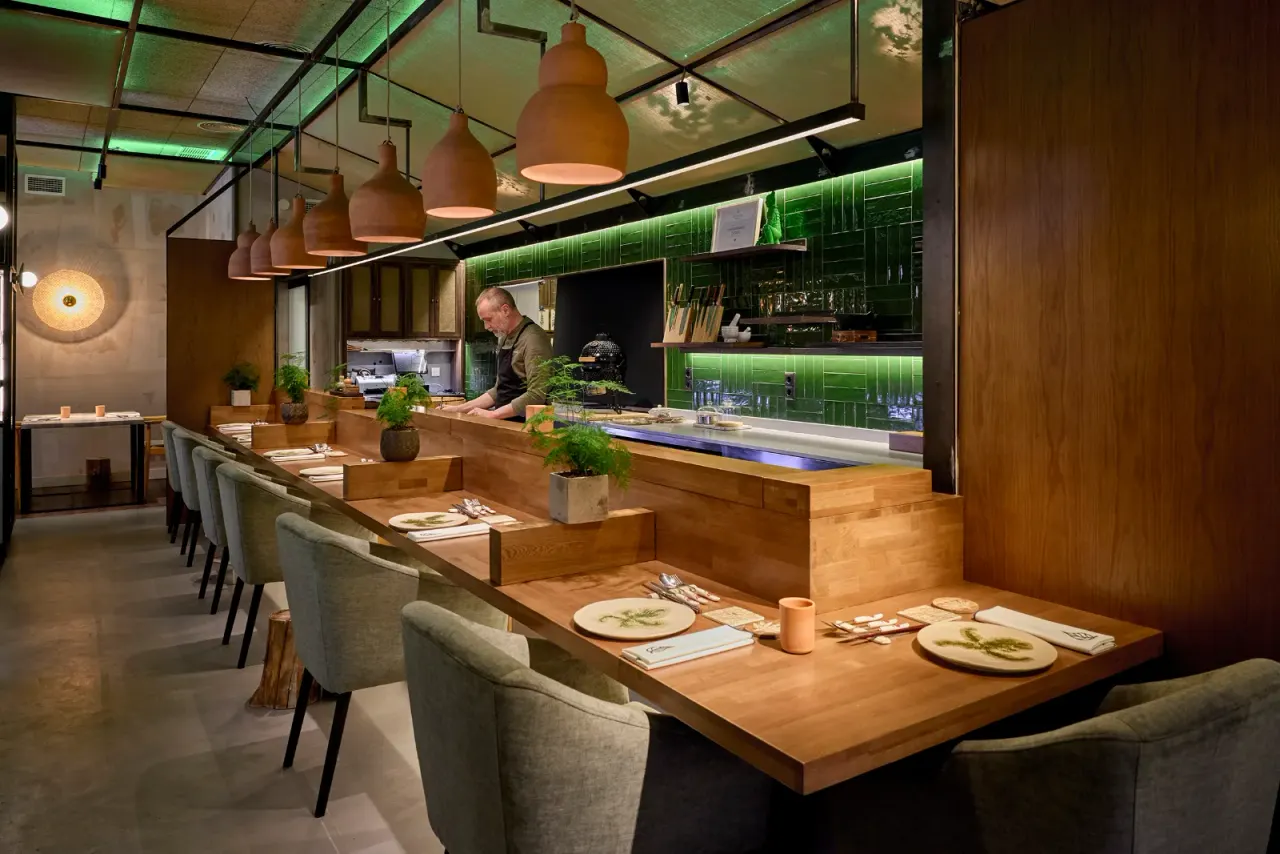 The long counter at El Invernadero with the open kitchen behind, before opening