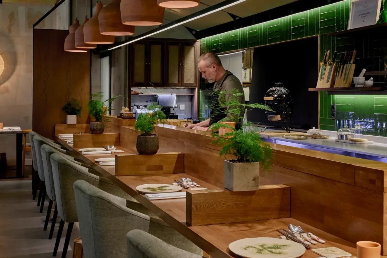 The counter at El Invernadero with the open kitchen behind, before service begins