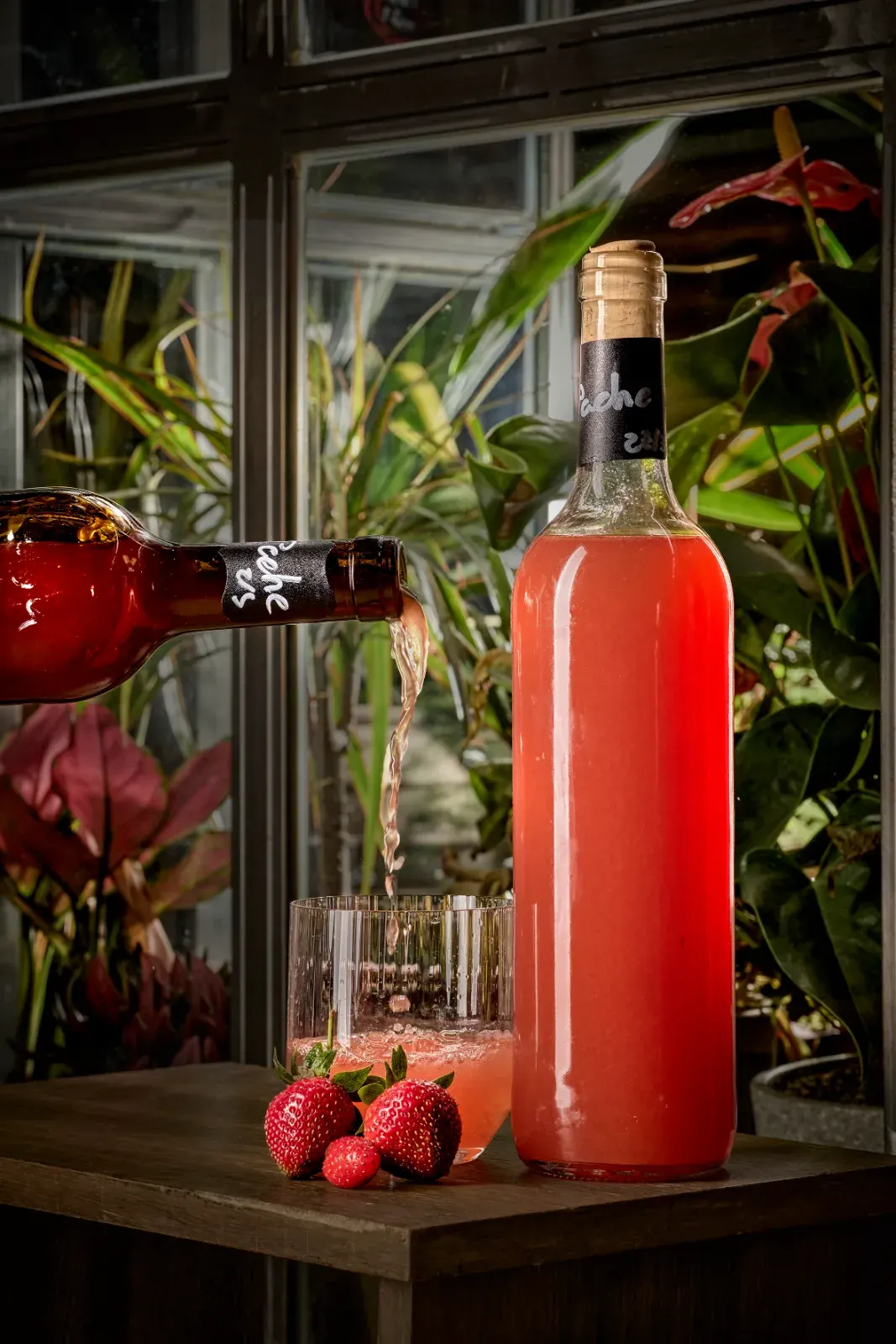 Bottled strawberry tepache, one of the house's fermented drinks